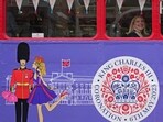 A tourist sits on a Coronation Tour Bus in London, Monday. A tourist sits on a Coronation Tour Bus in London, Monday.