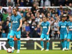 Tottenham's Harry Kane, left, reacts after Newcastle's Callum Wilson, not pictured, scored their side's sixth goal of the game during the English Premier League soccer match