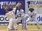 Ireland's Curtis Campher (L) plays a shot as Sri Lanka's wicketkeeper Sadeera Samarawickrama (C) looks on duringDay 2 of the second Test at the Galle International Cricket Stadium Ireland's Curtis Campher (L) plays a shot as Sri Lanka's wicketkeeper Sadeera Samarawickrama (C) looks on duringDay 2 of the second Test at the Galle International Cricket Stadium