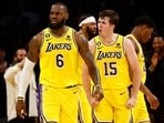LOS ANGELES, CALIFORNIA - APRIL 24: LeBron James #6 and Austin Reaves #15 of the Los Angeles Lakers react against the Memphis Grizzlies in overtime of Game Four of the Western Conference First Round Playoffs at Crypto.com Arena on April 24, 2023 in Los Angeles, California. NOTE TO USER: User expressly acknowledges and agrees that, by downloading and/or using this photograph, user is consenting to the terms and conditions of the Getty Images License Agreement. Ronald Martinez/Getty Images/AFP (Photo by RONALD MARTINEZ / GETTY IMAGES NORTH AMERICA / Getty Images via AFP) LOS ANGELES, CALIFORNIA - APRIL 24: LeBron James #6 and Austin Reaves #15 of the Los Angeles Lakers react against the Memphis Grizzlies in overtime of Game Four of the Western Conference First Round Playoffs at Crypto.com Arena on April 24, 2023 in Los Angeles, California. NOTE TO USER: User expressly acknowledges and agrees that, by downloading and/or using this photograph, user is consenting to the terms and conditions of the Getty Images License Agreement. Ronald Martinez/Getty Images/AFP (Photo by RONALD MARTINEZ / GETTY IMAGES NORTH AMERICA / Getty Images via AFP)