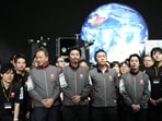 Takeshi Hakamada, center, founder and CEO of ispace, right, and his team staff gather for photo session after livestream of HAKUTO-R private lunar exploration program on screen at the lunar landing event Wednesday, April 26, 2023, at Miraikan, the National Museum of Emerging Science and Innovation, in Tokyo. Takeshi Hakamada, center, founder and CEO of ispace, right, and his team staff gather for photo session after livestream of HAKUTO-R private lunar exploration program on screen at the lunar landing event Wednesday, April 26, 2023, at Miraikan, the National Museum of Emerging Science and Innovation, in Tokyo.