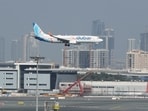 A Flydubai Boeing 737-800 airplane approaches for landing at Dubai Airport in Dubai, United Arab Emirates. Flydubai aircraft lands safely at Dubai Airport after catching fire 