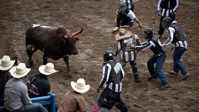 Inmates participate in the ‘Guts and Glory’, event where they attempt to remove a chip from a bull's head. According to the rodeo's website, “Guts and Glory,” is considered the most exciting event, reported AFP. (Brendan Smialowski / AFP) Inmates participate in the ‘Guts and Glory’, event where they attempt to remove a chip from a bull's head. According to the rodeo's website, “Guts and Glory,” is considered the most exciting event, reported AFP. (Brendan Smialowski / AFP)