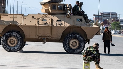 Taliban security personnel sit on an armoured vehicle outside the Eid Gah mosque in Kabul on April 20, 2023. (Photo by Wakil KOHSAR / AFP) (AFP) Taliban security personnel sit on an armoured vehicle outside the Eid Gah mosque in Kabul on April 20, 2023. (Photo by Wakil KOHSAR / AFP) (AFP)