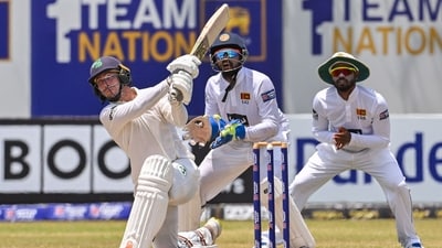 Ireland's Curtis Campher (L) plays a shot as Sri Lanka's wicketkeeper Sadeera Samarawickrama (C) looks on duringDay 2 of the second Test at the Galle International Cricket Stadium (AFP) Ireland's Curtis Campher (L) plays a shot as Sri Lanka's wicketkeeper Sadeera Samarawickrama (C) looks on duringDay 2 of the second Test at the Galle International Cricket Stadium (AFP)