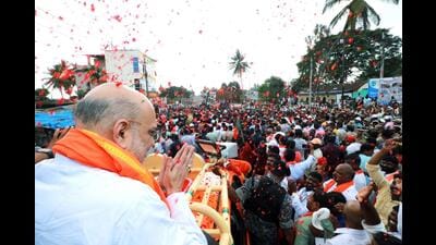 Home minister Amit Shah during a road show in Karnataka on Tuesday (PTI) Home minister Amit Shah during a road show in Karnataka on Tuesday (PTI)