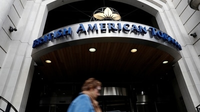FILE PHOTO: A woman walks past the British American Tobacco offices in London, Britain October 21, 2016. REUTERS/Stefan Wermuth/File Photo (REUTERS)
