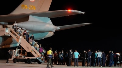 People disembark from an Air Force plane carrying Italian citizens evacuated from Sudan landed at the Ciampino Military airport in Rome, Monday, April 24, 2023. (AP Photo/Gregorio Borgia) (AP) People disembark from an Air Force plane carrying Italian citizens evacuated from Sudan landed at the Ciampino Military airport in Rome, Monday, April 24, 2023. (AP Photo/Gregorio Borgia) (AP)