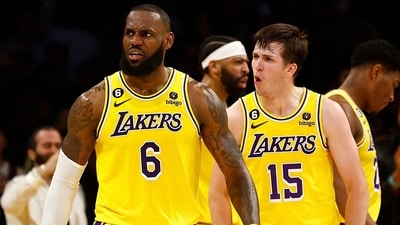 LOS ANGELES, CALIFORNIA - APRIL 24: LeBron James #6 and Austin Reaves #15 of the Los Angeles Lakers react against the Memphis Grizzlies in overtime of Game Four of the Western Conference First Round Playoffs at Crypto.com Arena on April 24, 2023 in Los Angeles, California. NOTE TO USER: User expressly acknowledges and agrees that, by downloading and/or using this photograph, user is consenting to the terms and conditions of the Getty Images License Agreement. Ronald Martinez/Getty Images/AFP (Photo by RONALD MARTINEZ / GETTY IMAGES NORTH AMERICA / Getty Images via AFP) (Getty Images via AFP) LOS ANGELES, CALIFORNIA - APRIL 24: LeBron James #6 and Austin Reaves #15 of the Los Angeles Lakers react against the Memphis Grizzlies in overtime of Game Four of the Western Conference First Round Playoffs at Crypto.com Arena on April 24, 2023 in Los Angeles, California. NOTE TO USER: User expressly acknowledges and agrees that, by downloading and/or using this photograph, user is consenting to the terms and conditions of the Getty Images License Agreement. Ronald Martinez/Getty Images/AFP (Photo by RONALD MARTINEZ / GETTY IMAGES NORTH AMERICA / Getty Images via AFP) (Getty Images via AFP)