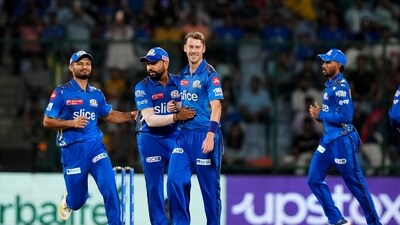 Mumbai Indians bowler Riley Meredith with teammate Rohit Sharma celebrate the wicket of Delhi Capitals batter Yash Dhull (PTI) Mumbai Indians bowler Riley Meredith with teammate Rohit Sharma celebrate the wicket of Delhi Capitals batter Yash Dhull (PTI)