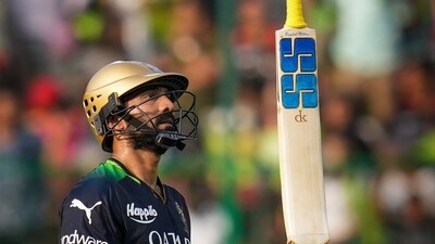 Bengaluru: Royal Challengers Bangalore batter Dinesh Karthik walks back to pavilion after his dismissal during the IPL 2023 cricket match between Royal Challengers Bangalore and Rajasthan Royals, at M Chinnaswamy Stadium in Bengaluru, Sunday, April 23, 2023. (PTI Photo/Shailendra Bhojak)(PTI04_23_2023_000206A) (PTI) Bengaluru: Royal Challengers Bangalore batter Dinesh Karthik walks back to pavilion after his dismissal during the IPL 2023 cricket match between Royal Challengers Bangalore and Rajasthan Royals, at M Chinnaswamy Stadium in Bengaluru, Sunday, April 23, 2023. (PTI Photo/Shailendra Bhojak)(PTI04_23_2023_000206A) (PTI)