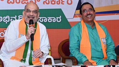 Union Home Minister Amit Shah with Union Minister Pralhad Joshi in Hubballi on Monday. (PTI) Union Home Minister Amit Shah with Union Minister Pralhad Joshi in Hubballi on Monday. (PTI)