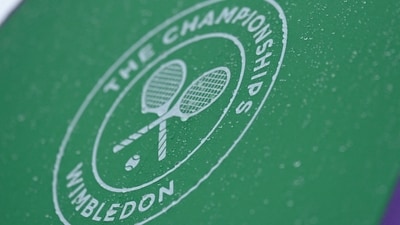 General view as rain drops are seen on a Wimbledon umbrella (REUTERS)