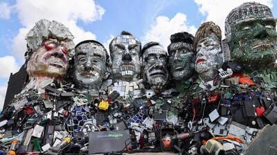 The 20-ft high sculpture will be inspired by Mount Recyclemore, a sculpture of G7 leaders made up of scrap material set up in Cornwall, England in 2021. (Reuters) The 20-ft high sculpture will be inspired by Mount Recyclemore, a sculpture of G7 leaders made up of scrap material set up in Cornwall, England in 2021. (Reuters)