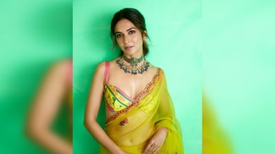 This frisky yellow saree features a hand-beaded scallop cutwork which has pink highlights with sequins and threadwork. (Instagram/@kriti.kharbanda) This frisky yellow saree features a hand-beaded scallop cutwork which has pink highlights with sequins and threadwork. (Instagram/@kriti.kharbanda)