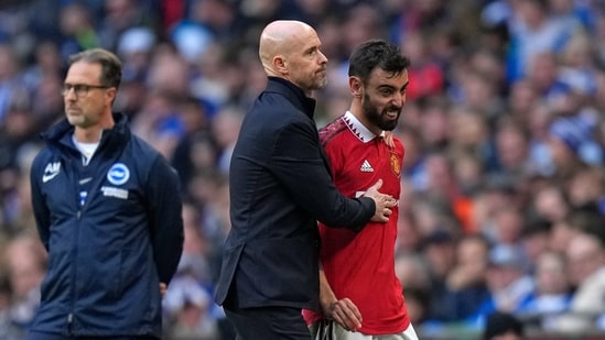 Manchester United's Bruno Fernandes is substituted by Manchester United's head coach Erik ten Hag during the English FA Cup semifinal soccer match between Brighton and Hove Albion and Manchester United at Wembley Stadium in London, Sunday, April 23, 2023. (AP Photo/Alastair Grant) (AP)