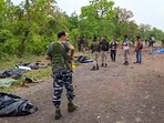 Security personnel at the site after at least ten police personnel and a driver were killed in a blast carried out by Naxalites in Chhattisgarh's Dantewada. Security personnel at the site after at least ten police personnel and a driver were killed in a blast carried out by Naxalites in Chhattisgarh's Dantewada.