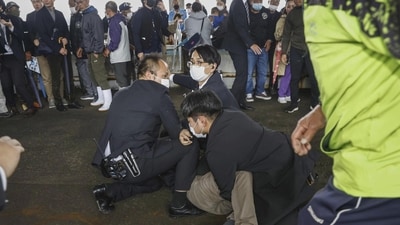 A man threw an explosive device at Kishida as the prime minister was about to make a campaign speech (Kyodo News via AP) A man threw an explosive device at Kishida as the prime minister was about to make a campaign speech (Kyodo News via AP)