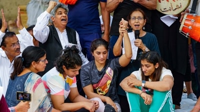 New Delhi: Wrestlers Vinesh Phogat (centre), Sangita Phogat (right), Sakshi Malik and others during their protest at Jantar Mantar, in New Delhi, Wednesday, April 26, 2023. (PTI Photo/Atul Yadav)(PTI04_26_2023_000163B) (PTI) New Delhi: Wrestlers Vinesh Phogat (centre), Sangita Phogat (right), Sakshi Malik and others during their protest at Jantar Mantar, in New Delhi, Wednesday, April 26, 2023. (PTI Photo/Atul Yadav)(PTI04_26_2023_000163B) (PTI)