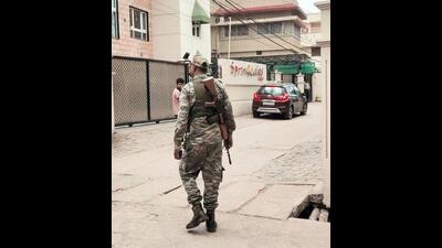 Paramilitary personnel stand guard outside Springdales School during a raid conducted by ED linked to IAS officer Chhavi Ranjan in Ranchi on Wednesday. (ANI) Paramilitary personnel stand guard outside Springdales School during a raid conducted by ED linked to IAS officer Chhavi Ranjan in Ranchi on Wednesday. (ANI)