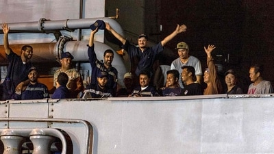 Sudan clashes: Saudi Navy Forces and evacuees on the deck of a ship upon arrival at King Faisal navy base in Jeddah, following a rescue operation from Sudan. (AFP)