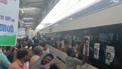 People can be seen pasting the posters Sreekandan on the windows of the train. (Twitter/ ANI) People can be seen pasting the posters Sreekandan on the windows of the train. (Twitter/ ANI)