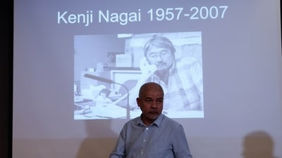 Aye Chan Naing from Democratic Voice of Burma holds the video camera of slain Japanese journalist Kenji Nagai 
before handing over to his sister Noriko Ogawa, at the Foreign Correspondents Club in Bangkok, Thailand Wednesday, April 26. (AP)