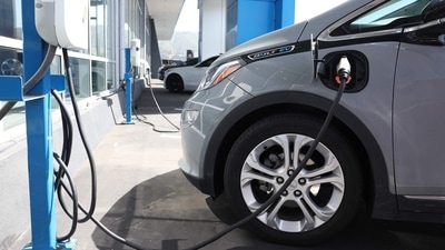 A Chevrolet Bolt EV sits parked at a charging station at Stewart Chevrolet on April 25, 2023 in Colma, California. (Getty Images via AFP) A Chevrolet Bolt EV sits parked at a charging station at Stewart Chevrolet on April 25, 2023 in Colma, California. (Getty Images via AFP)
