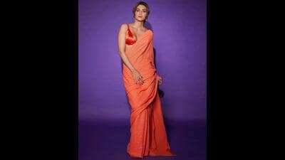 Body type and comfort: Consider your body type and choose a saree that flatters your figure. If you're petite, opt for lighter fabrics and minimalistic designs to avoid overwhelming your frame. Additionally, prioritize comfort by selecting a saree that allows you to move and sit comfortably throughout the day. (Instagram/@kritisanon)