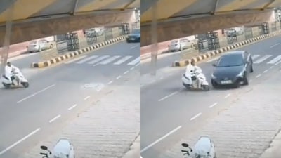 The image, taken from the viral video, shows a speeding car hitting scooty. (Twitter/@DCPTrEastBCP) The image, taken from the viral video, shows a speeding car hitting scooty. (Twitter/@DCPTrEastBCP)