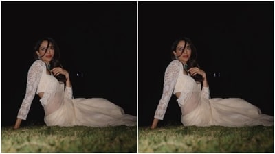 Sobhita picked a sheer white chiffon saree for the pictures as she posed in a garden of sorts for a night photoshoot. (Instagram/@sobhitad) Sobhita picked a sheer white chiffon saree for the pictures as she posed in a garden of sorts for a night photoshoot. (Instagram/@sobhitad)