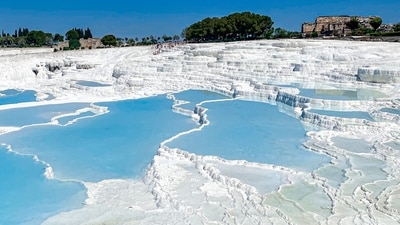 Pamukkale, Turkey: These hot springs have created terraces of white mineral deposits, giving the landscape a snowy appearance. (Unsplash) Pamukkale, Turkey: These hot springs have created terraces of white mineral deposits, giving the landscape a snowy appearance. (Unsplash)