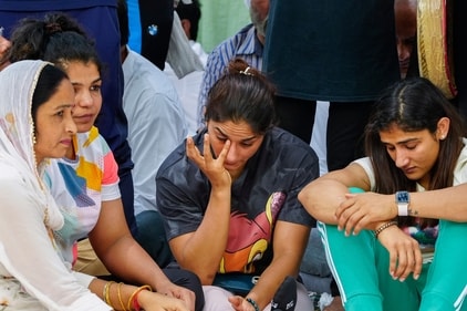 New Delhi: Wrestlers Vinesh Phogat (centre), Sangita Phogat (right), Sakshi Malik and others during their protest at Jantar Mantar, in New Delhi, Wednesday, April 26, 2023. (PTI) New Delhi: Wrestlers Vinesh Phogat (centre), Sangita Phogat (right), Sakshi Malik and others during their protest at Jantar Mantar, in New Delhi, Wednesday, April 26, 2023. (PTI)