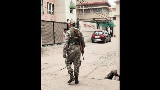 Paramilitary personnel stand guard outside Springdales School during a raid conducted by ED linked to IAS officer Chhavi Ranjan in Ranchi on Wednesday. (ANI)