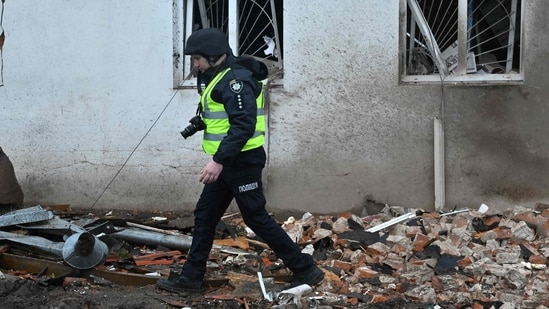 Russia-Ukraine War: A Ukrainian policeman walks next to the local history museum destroyed following Russian missile strike in the town of Kupiansk, Kharkiv region. (AFP)