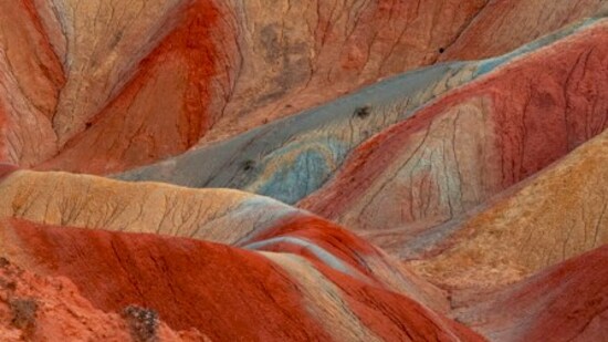 Zhangye Danxia Landform, China: These colourful mountains are a result of millions of years of mineral deposits, giving them a striped and surreal appearance.&nbsp;(Unsplash)