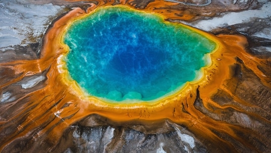 Grand Prismatic Spring, Yellowstone National Park, USA: This hot spring is the largest in the United States and has vibrant colours ranging from blue to orange, making it look almost like a painting.&nbsp;(Unsplash)