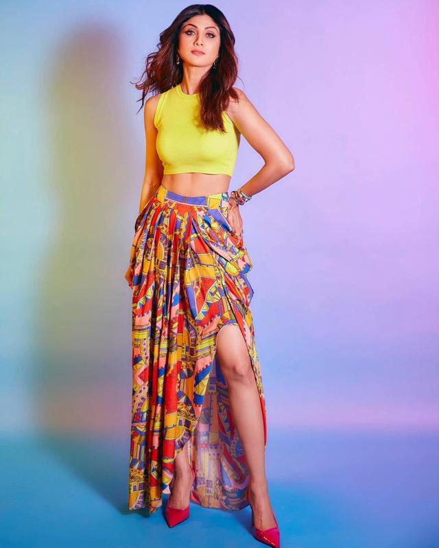 Shilpa Shetty Kundra makes a statement in a neon yellow crop top and slit skirt with aztec print (Photo: Instagram) Shilpa Shetty Kundra makes a statement in a neon yellow crop top and slit skirt with aztec print (Photo: Instagram)