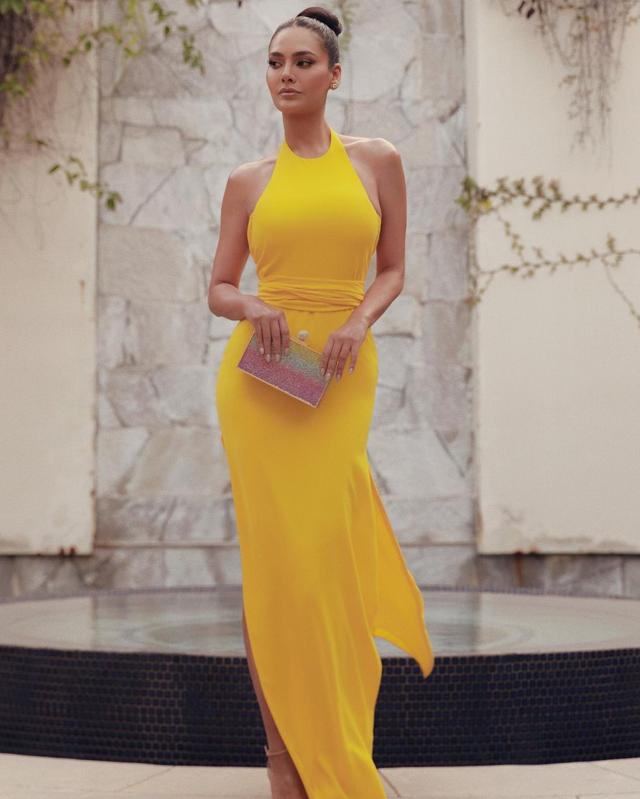 Esha Gupta in a halterneck neon yellow dress (Photo: Instagram) Esha Gupta in a halterneck neon yellow dress (Photo: Instagram)