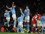 Manchester City's John Stones celebrates scoring their second goal with Ruben Dias and Rodri 