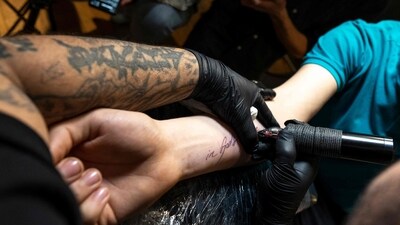 The mother and the stepfather allegedly tied down their children, 9- and 5-year-old, and forcibly pressed the needle into their skin for the tattoos. (AFP) The mother and the stepfather allegedly tied down their children, 9- and 5-year-old, and forcibly pressed the needle into their skin for the tattoos. (AFP)