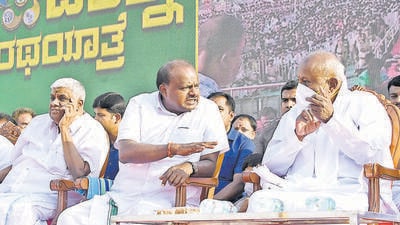 Former prime minister HD Deve Gowda (right) with his son HD Kumaraswamy at a programme in Mysuru on March 26. (PTI) Former prime minister HD Deve Gowda (right) with his son HD Kumaraswamy at a programme in Mysuru on March 26. (PTI)