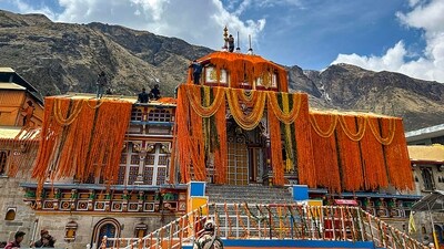 Badrinath Temple, decorated with flowers, on the eve of its doors opening, in Chamoli. (PTI) Badrinath Temple, decorated with flowers, on the eve of its doors opening, in Chamoli. (PTI)