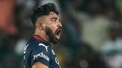 Royal Challengers Bangalore bowler Mohammed Siraj celebrates after taking the wicket of Kolkata Knight Riders batter Andre Russell (PTI) Royal Challengers Bangalore bowler Mohammed Siraj celebrates after taking the wicket of Kolkata Knight Riders batter Andre Russell (PTI)