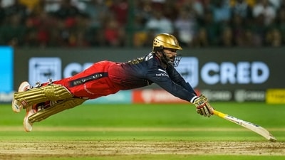 Dinesh Karthik dives to reach the crease. (PTI) Dinesh Karthik dives to reach the crease. (PTI)