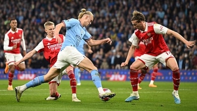 Arsenal's English defender Rob Holding (R) defends from Manchester City's Norwegian striker Erling Haaland during the English Premier League football match between Manchester City and Arsenal (AFP) Arsenal's English defender Rob Holding (R) defends from Manchester City's Norwegian striker Erling Haaland during the English Premier League football match between Manchester City and Arsenal (AFP)