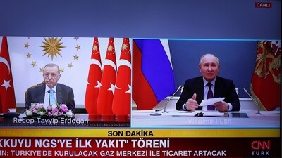 This photograph taken on April 27, 2023, shows a screen in Ankara broadcasting the live feed of TV channel CNN Turk, showing President of the Republic of Turkey Recep Tayyip Erdogan (L) and President of Russia Vladimir Putin (R) speaking over video link, for the opening of Akkuyu Nuclear Power Plant held in Mersin. (AFP) This photograph taken on April 27, 2023, shows a screen in Ankara broadcasting the live feed of TV channel CNN Turk, showing President of the Republic of Turkey Recep Tayyip Erdogan (L) and President of Russia Vladimir Putin (R) speaking over video link, for the opening of Akkuyu Nuclear Power Plant held in Mersin. (AFP)
