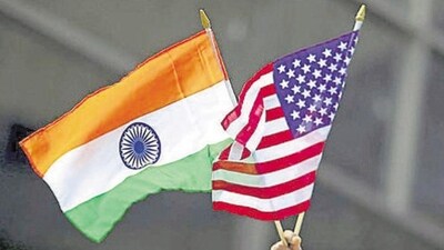A man holds the flags of India and the US. (REUTERS) A man holds the flags of India and the US. (REUTERS)