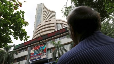 A man looks at a screen across a road displaying the Sensex on the facade of the Bombay Stock Exchange (BSE) building in Mumbai, India. (File image) (REUTERS)