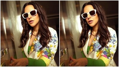 Neha matched the morning vibe in a bright green bodycon dress featuring full sleeves and a plunging neckline. She added more summer vibes to her look with a white shrug with floral patterns in shades of multiple colours and quarter sleeves. (Instagram/@nehadhupia) Neha matched the morning vibe in a bright green bodycon dress featuring full sleeves and a plunging neckline. She added more summer vibes to her look with a white shrug with floral patterns in shades of multiple colours and quarter sleeves. (Instagram/@nehadhupia)